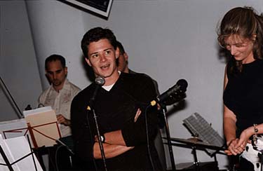 Producer Jason Lyon addresses the crowd at the New York premiere party as Tessa Blake looks on, October 7, 1999.