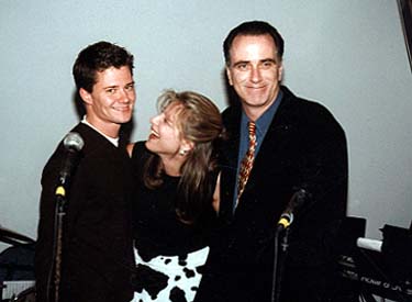 Producer Jason Lyon, Tessa Blake, and Musical Director George Gilmore share a laugh during the 'Five Wives' premiere party in New York, October 7, 1999.